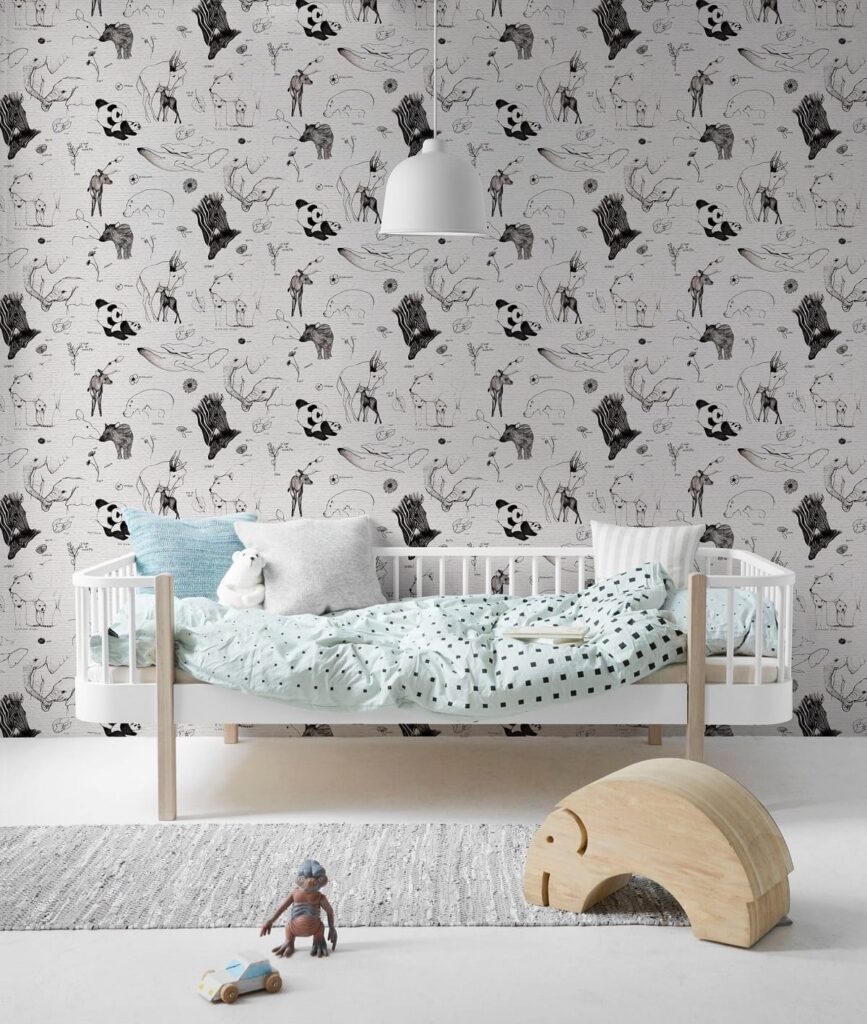 Black and white baby animals wallpaper for kids' room decor.