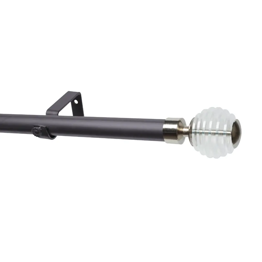 Gun metal curtain pole with clear ball finial for window decor.