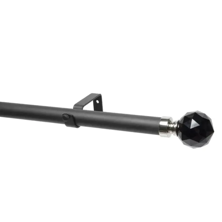 Black curtain pole with black crystal ball finial for elegant window decor.