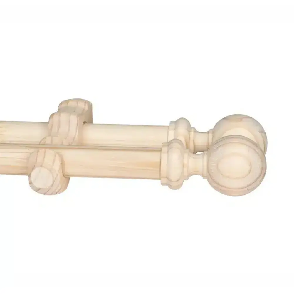 Natural wooden double curtain pole with ball finials for classic window decor.