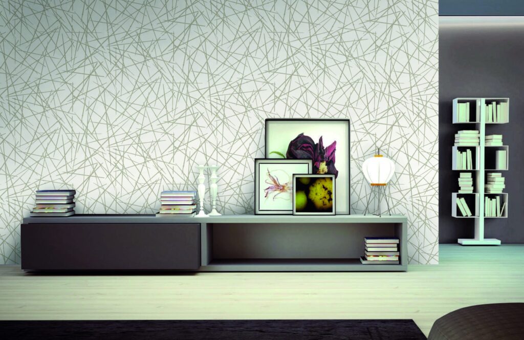 Modern grey wallpaper with geometric pattern in stylish living room.