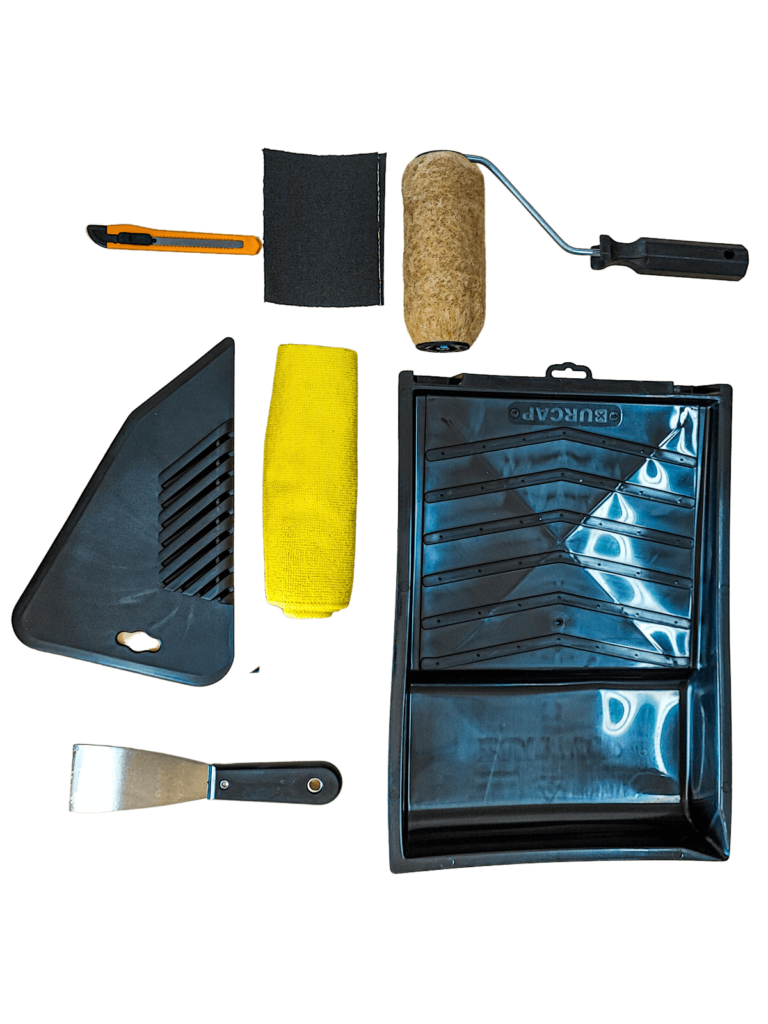 Handlanger wallpaper hanging kit with roller, scraper, and tools for wall preparation.