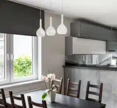 Modern kitchen with blockout fabric roller blind in graphite color.