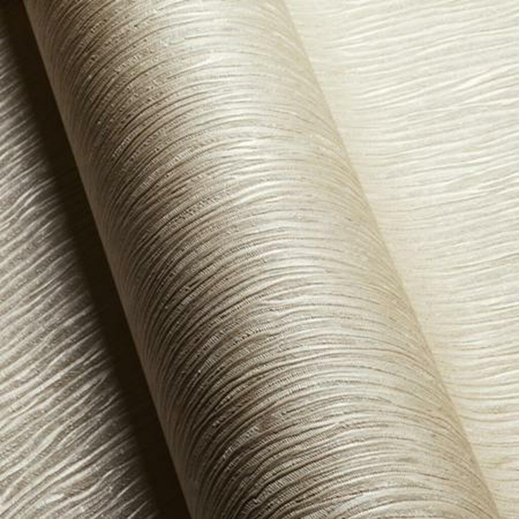 Close-up of champagne-colored textured wallpaper with shadow effect.