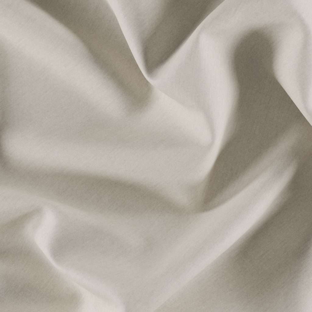 Close-up of smooth, cream-colored fabric with soft folds.