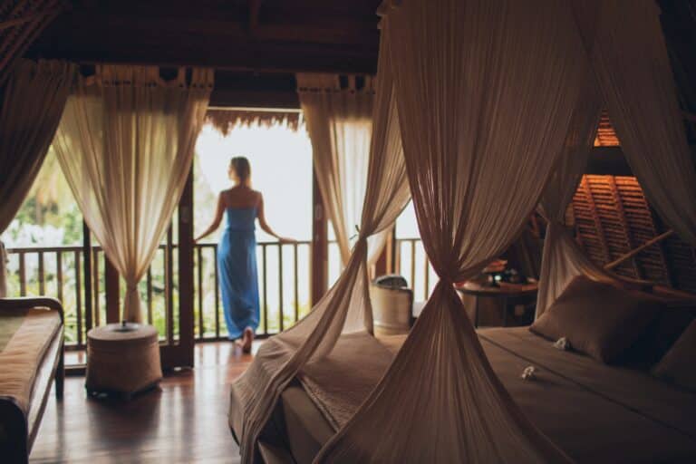 Lady standing by window