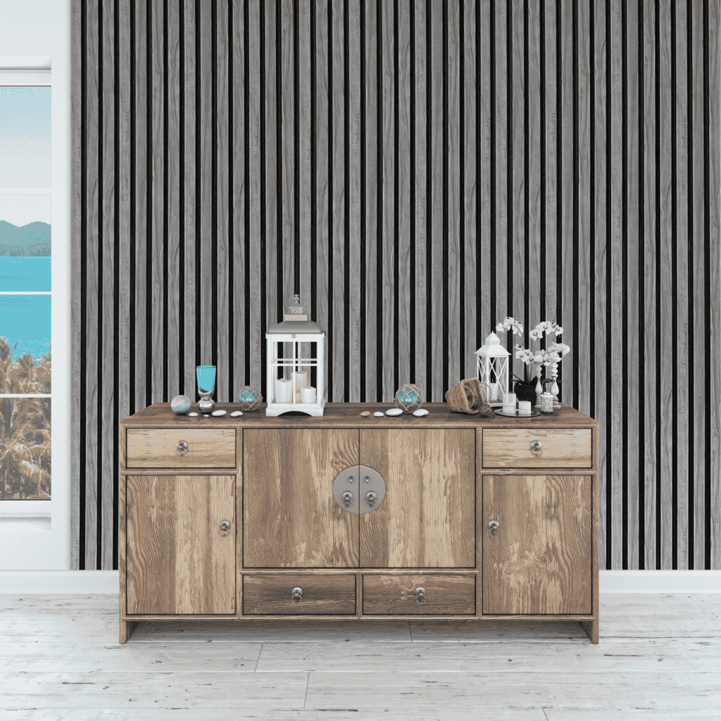 Wide slatted grey wall panel behind a wooden sideboard with decor items.