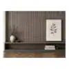 Modern grey and black wall panel with decorative plant and framed artwork.