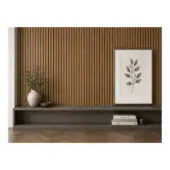 Modern interior wall with wooden slats, framed botanical art, and decorative vase and books.