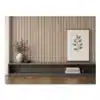 Oak black wall panel with decorative shelf and framed botanical art.